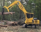 New Komatsu Swing Machine taking care of logs in forest,New Swing Machine lifting logs